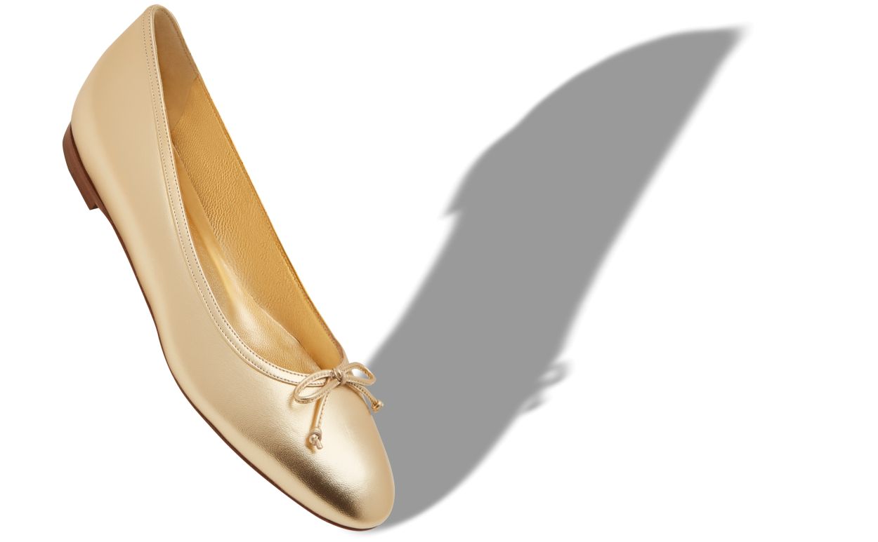 Zapatillas planas de cuero napa dorado