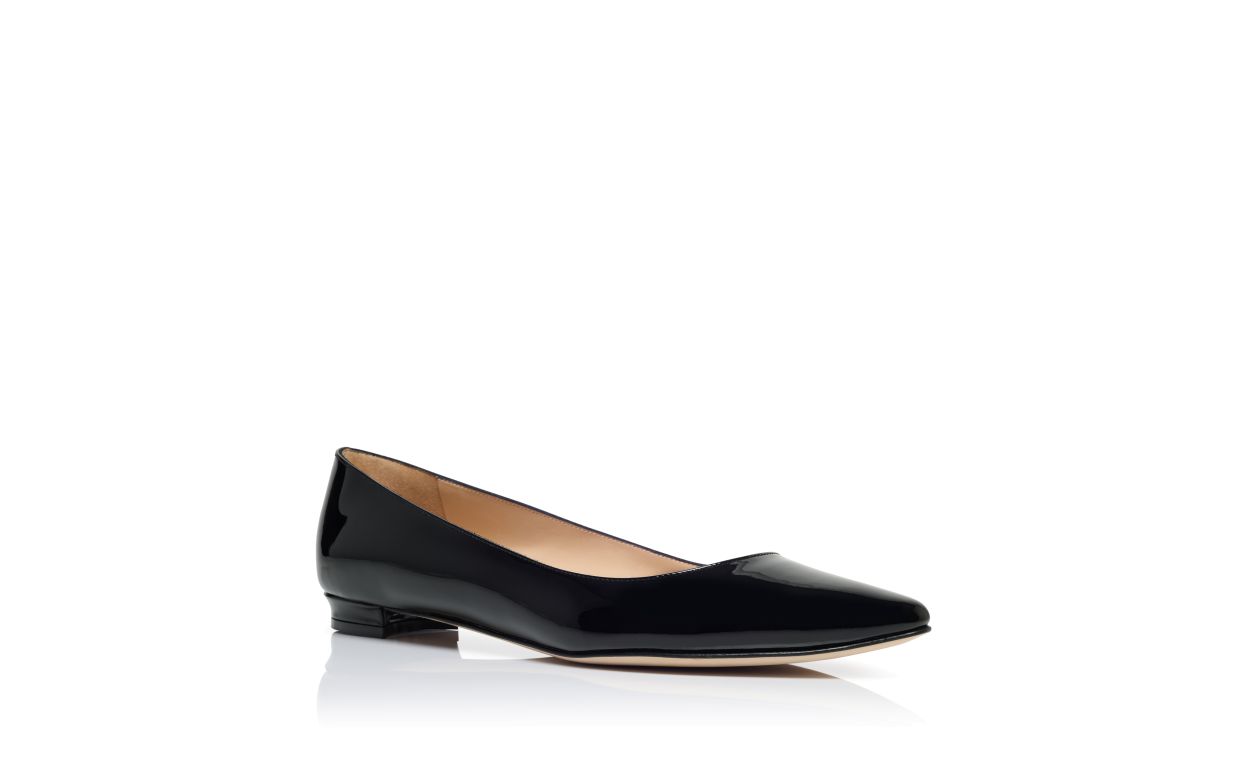 Zapatillas planas de cuero brillante negro con punta puntiaguda